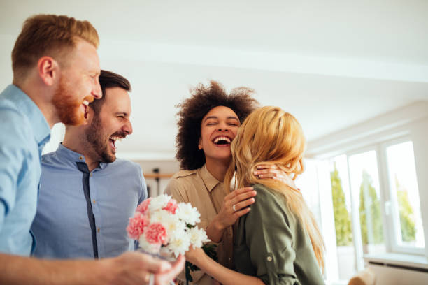 A newly engaged couple discusses wedding plans with their attendants, including party rental supplies like chairs, tables, tents, and more.