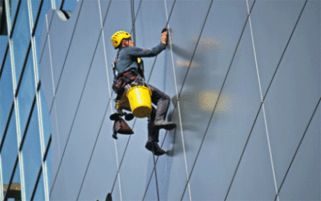 Window cleaning professional providing window washing services